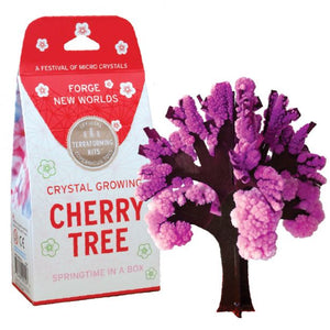 Pink crystals growing on paper tree branches portland toy store